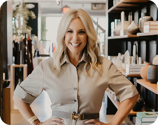 Smiling woman in an interior design setting.